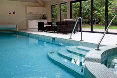 A pool extension viewed from the outside also showing the hosue it is attached to