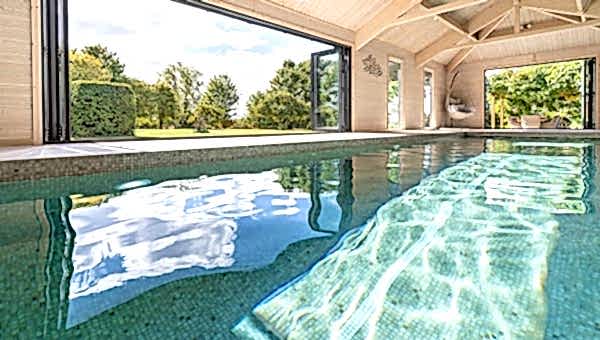 indoor pool, with doors open and reflections from the water surface